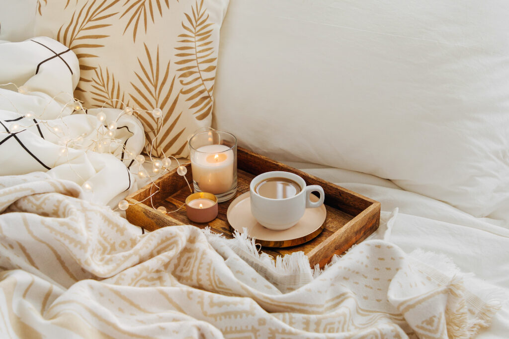 Wooden tray with coffee and candles for a self care Sunday quotes day