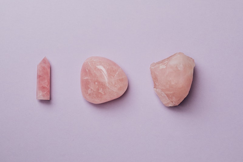 three rose quartz crystal stones