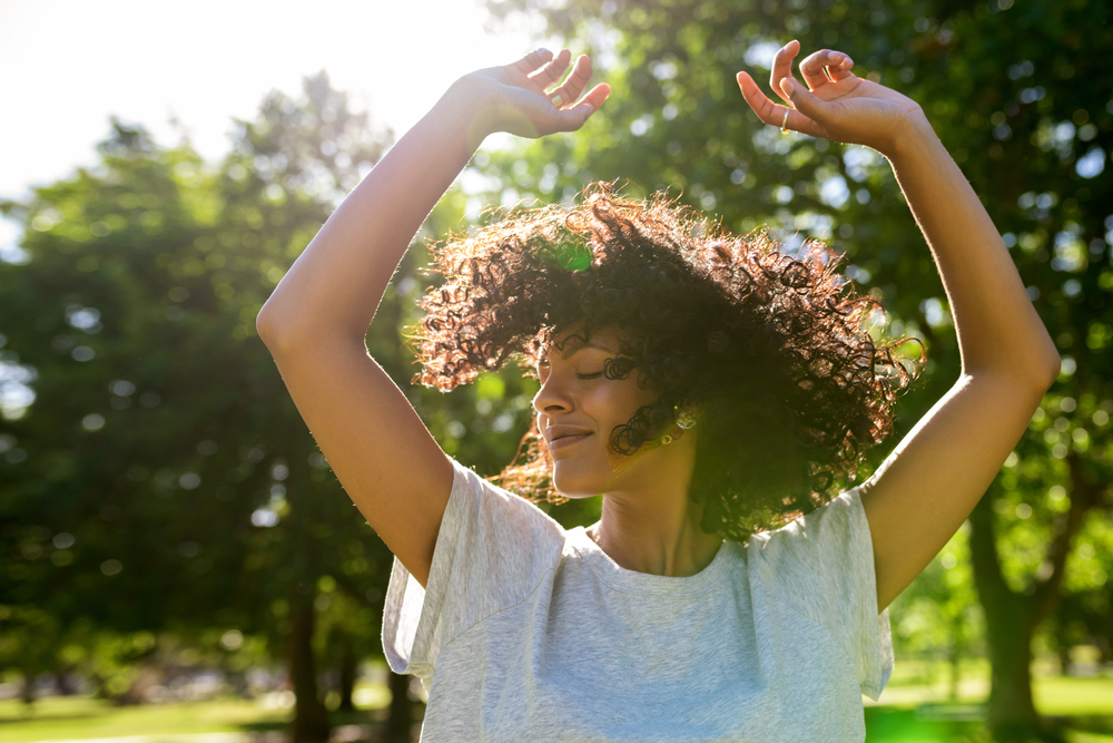 Women dancing in sun. Healing after birth, loss or burnout