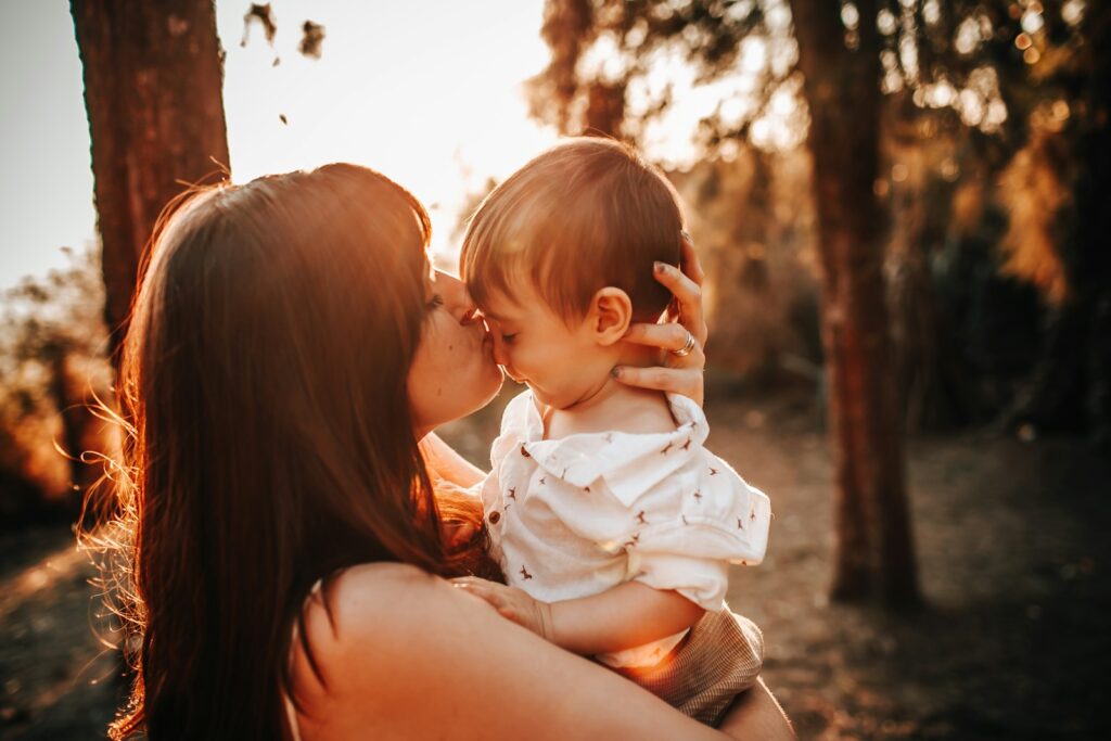 emotional landscape of postpartum - woman carrying baby during daytime