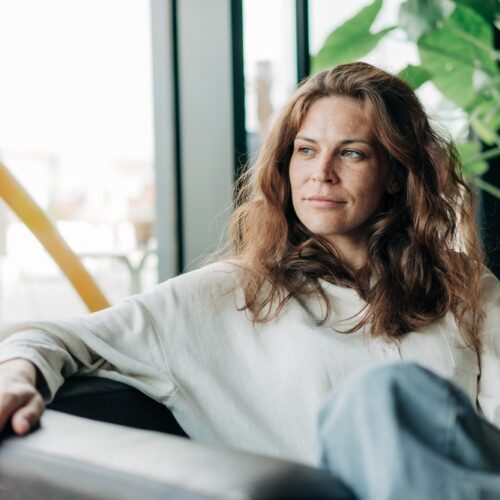 mindfulness without fixing, woman sitting calm on couch